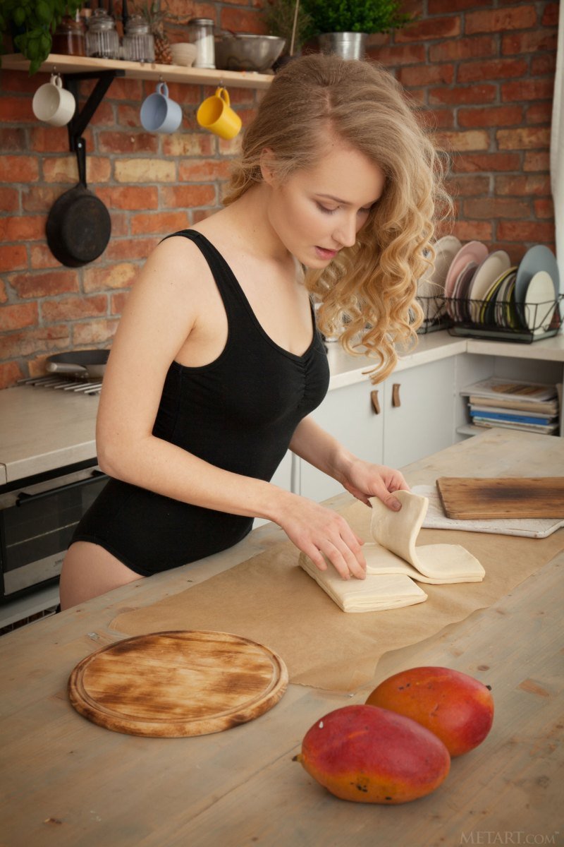 curly-blonde-goddess-shows-off-her-cooking-skills-naked-and-teases-with-her-dele.jpg